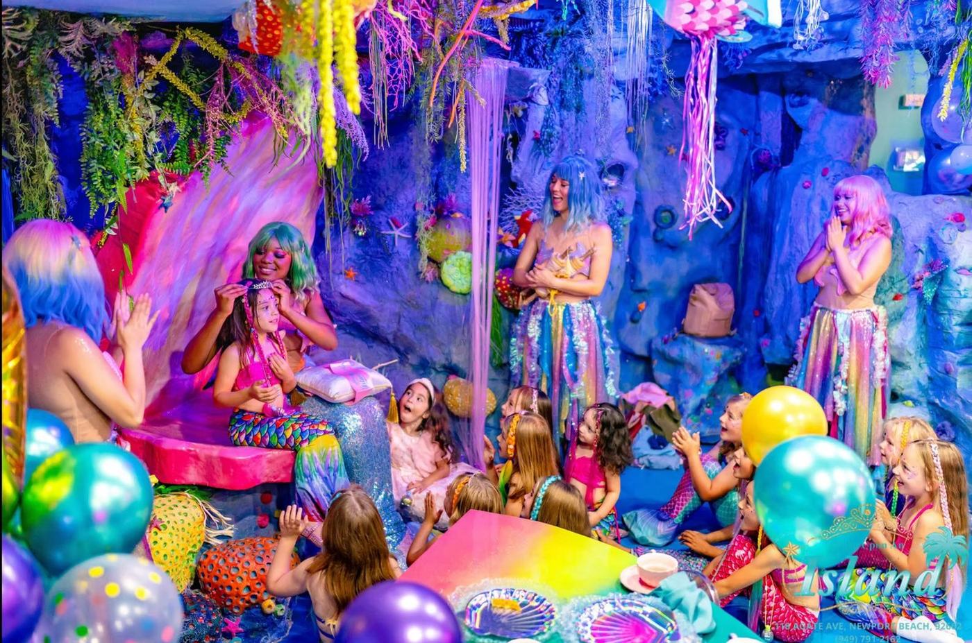 Child sharing an immersive tea party with a mermaid