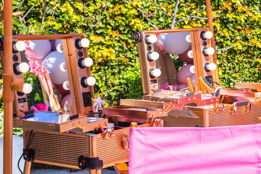 The illuminated traveling salon styling stations, set up at a private home