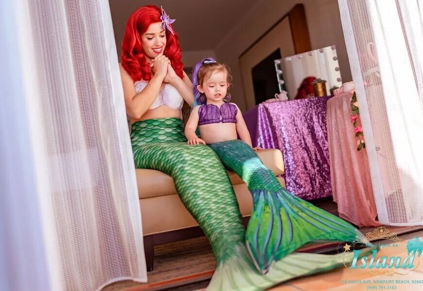 A mermaid character visiting a toddler at home